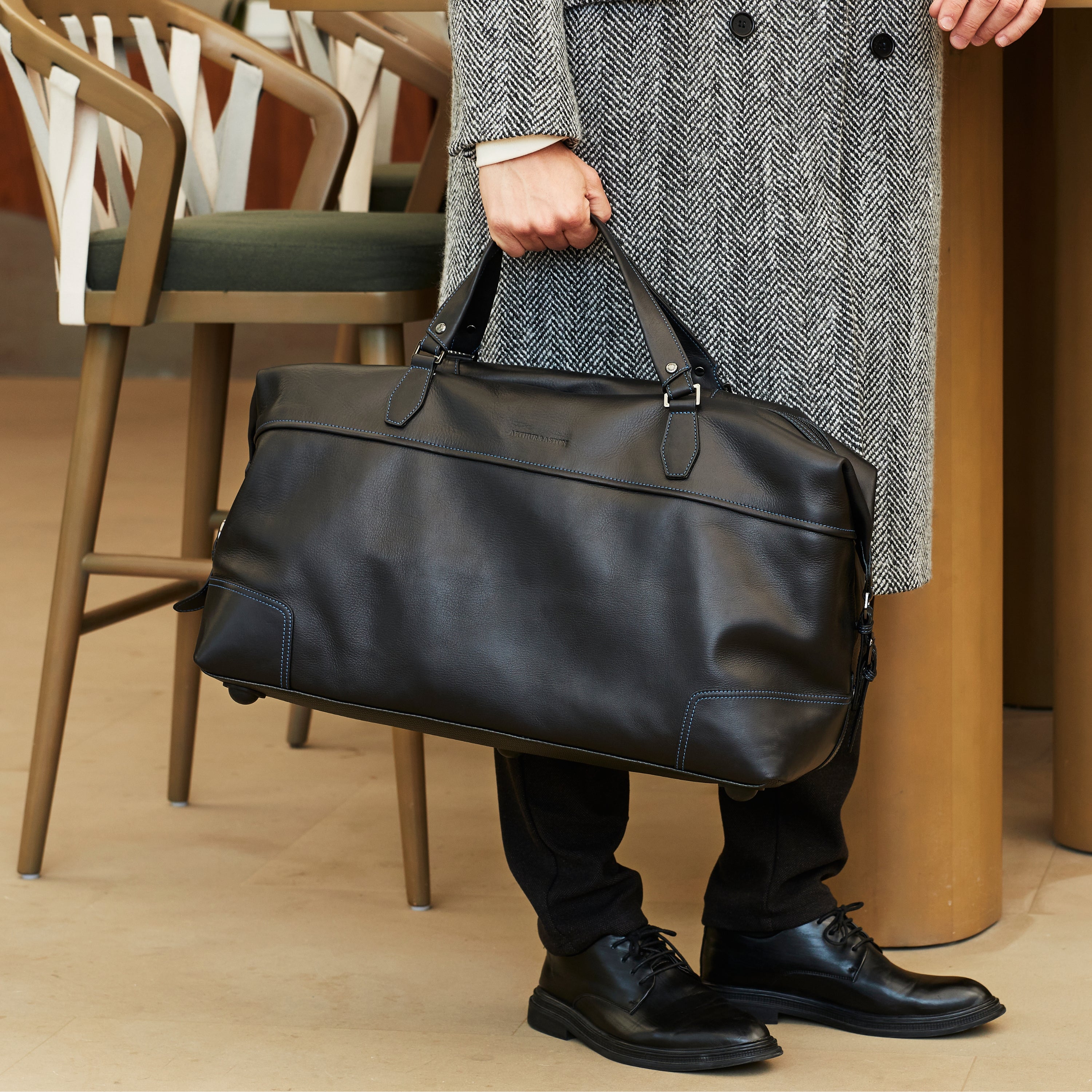 Large travel bag in dipped leather 