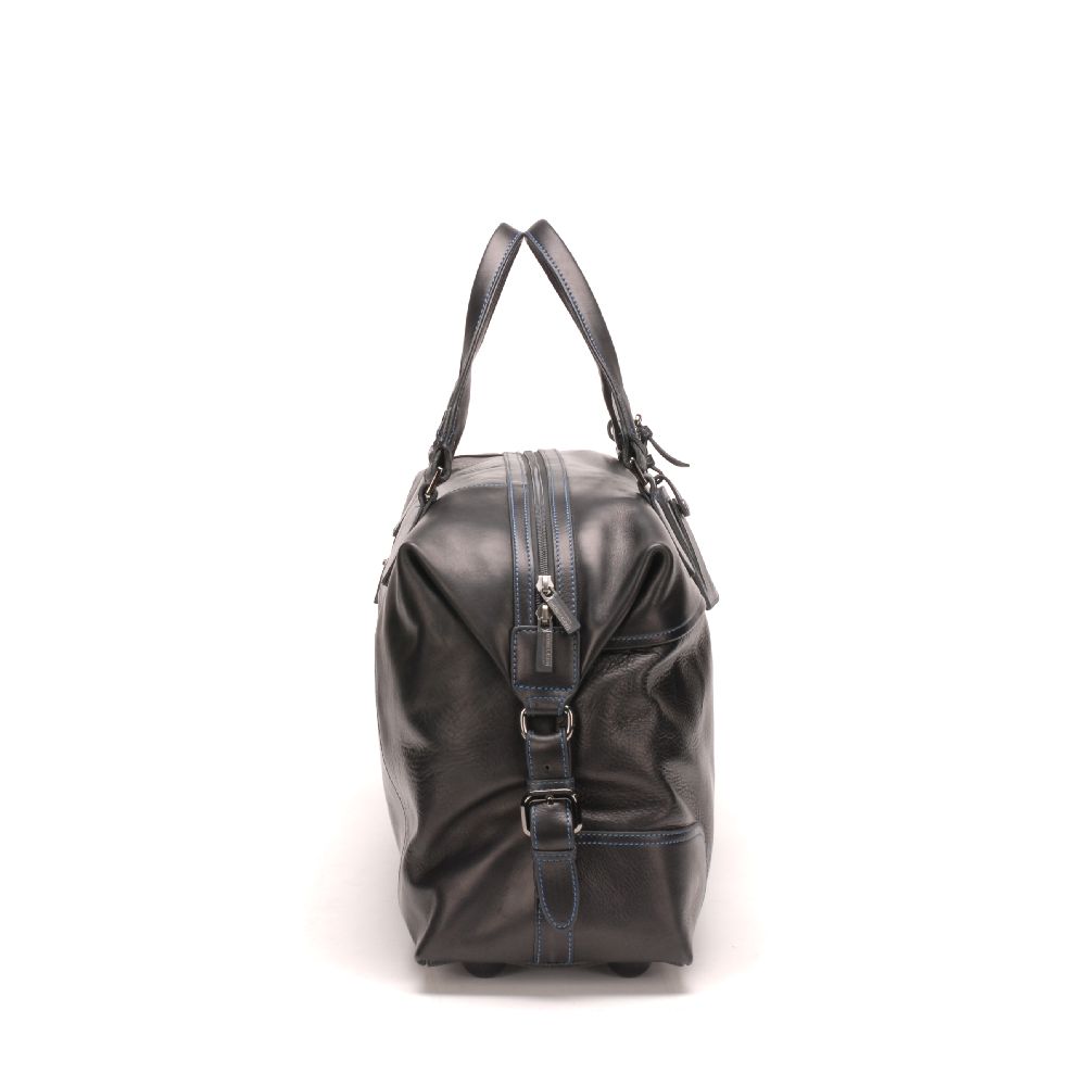 Large travel bag in dipped leather 