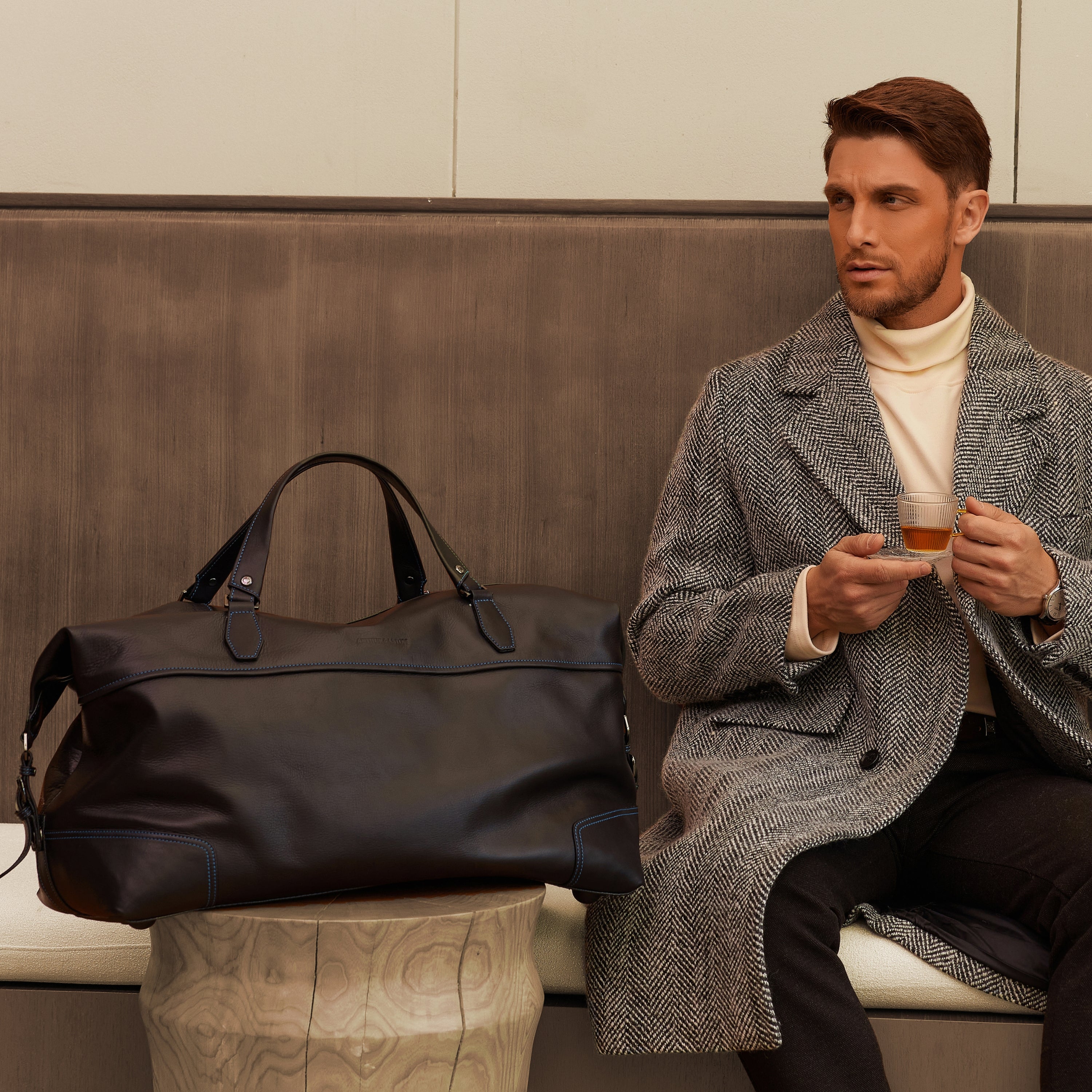 Large travel bag in dipped leather 